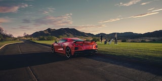 Side View of a 2025 Red Stingray on a Shade with a Girl behind It