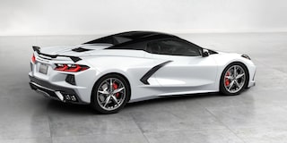 White 2025 Chevrolet Stingray Driving Downtown